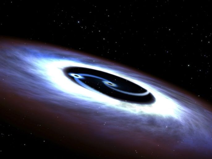 Markarian 231, a binary black hole found in the center of the nearest quasar host galaxy to Earth, is seen in a NASA illustration released August 27, 2015. Like a pair of whirling skaters, the black-hole duo generates tremendous amounts of energy that makes the core of the host galaxy outshine the glow of the galaxy's population of billions of stars, according to a NASA news release. Hubble observations of the ultraviolet light emitted from the nucleus of the galaxy w