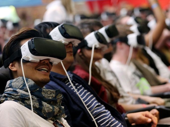 Visitors try out a 4-D rollercoaster ride with the Samsung Gear VR goggles at the Gamescom gaming convention in Cologne, Germany, 18 August 2016. The Gamescom gaming convention runs from 17 to 21 August 2016.