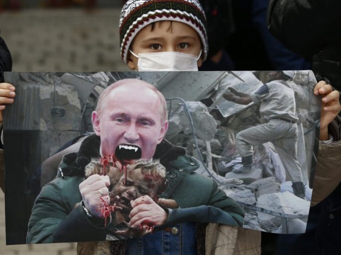 A child holding a poster depicting Russian President Vladimir Putin as a vampire stands among a group of Muslims from many countries living in South-Korea during a rally against the Russian government's policy on Syria, in downtown Seoul, South Korea, 19 December 2016. Residents of Aleppo have been under siege for weeks and have suffered bombardment, together with chronic food and fuel shortages due to fighting between government forces and their allies, including Russia, and anti-government combatants. An evacuation of civilians and fighters from the last rebel-held territory in the northern Syrian city of Aleppo was halted on 16 December amid reports of renewed violence.