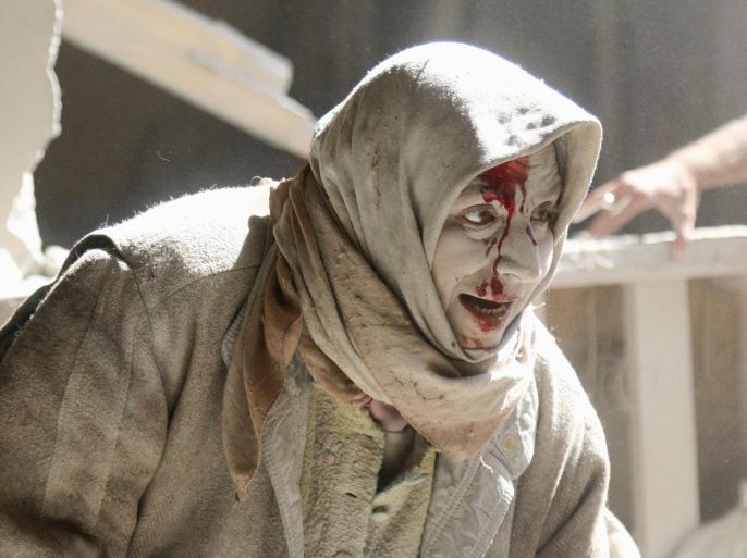 ATTENTION EDITORS - VISUAL COVERAGE OF SCENES OF INJURYAn injured woman reacts at a site hit by airstrikes in the rebel held area of Old Aleppo, Syria, April 28, 2016. REUTERS/Abdalrhman Ismail/File Photo