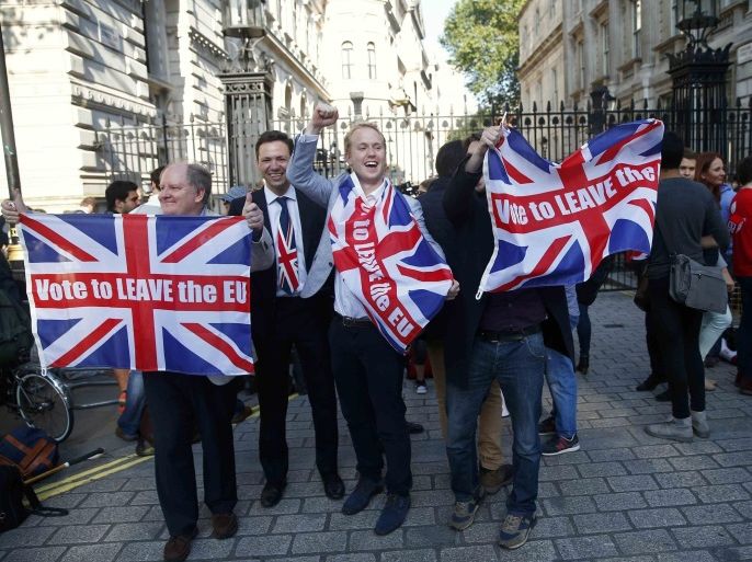 Vote Leave supporters wave Union flags, following the result of the EU referendum, outside Downing Street in London, Britain June 24, 2016. REUTERS/Neil Hall/File Photo