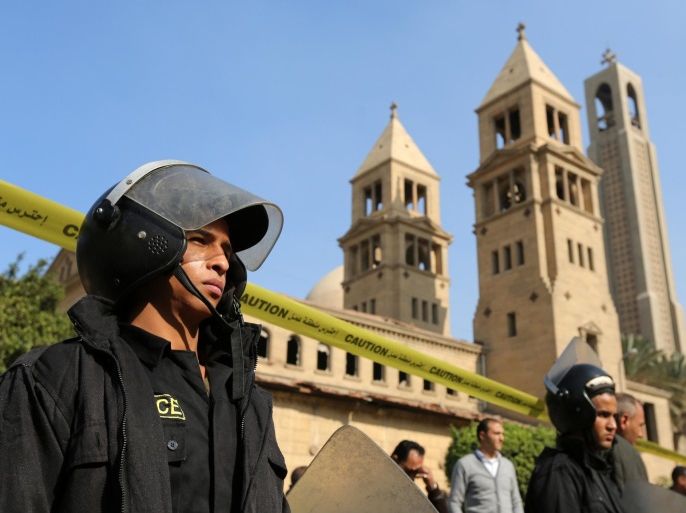Members of the special police forces stand guard to secure the area around St. Mark's Coptic Orthodox Cathedral after an explosion inside the cathedral in Cairo, Egypt December 11, 2016. REUTERS/Mohamed Abd El Ghany