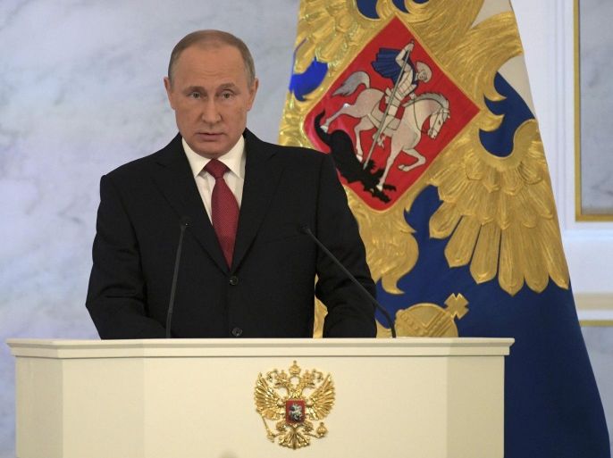 Russian President Vladimir Putin delivers a speech during his annual state of the nation address at the Kremlin in Moscow, Russia, December 1, 2016. Sputnik/Kremlin/Alexei Druzhinin via REUTERS ATTENTION EDITORS - THIS IMAGE WAS PROVIDED BY A THIRD PARTY. EDITORIAL USE ONLY.