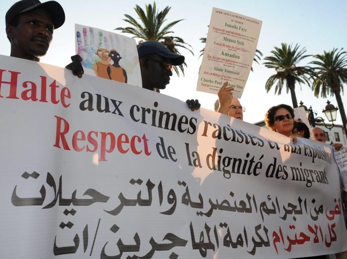 Activists demonstrate against racism in front of the Moroccan parliament in Rabat, Morocco, 11 September 2014. Protesters gathered after the sixth recent death of an immigrant in the country. Charles Ndou, a Senegalese migrant, was stabbed to death by a mob in Tangiers on 30 August 2014.