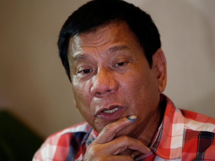 Presidential candidate Rodrigo "Digong" Duterte talks to reporters in Davao city in southern Philippines, May 9, 2016. REUTERS/Erik De Castro