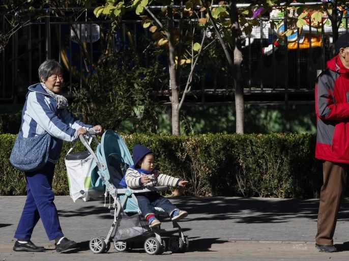 Chinese grandparents take their grandchild to a public park in Beijing, China, 30 October 2015. China is to abolish its one-child policy and allow all couples to have two children, the official Xinhua news agency reported on 29 October from a meeting of the Central Committee of the Communist Party in Beijing.