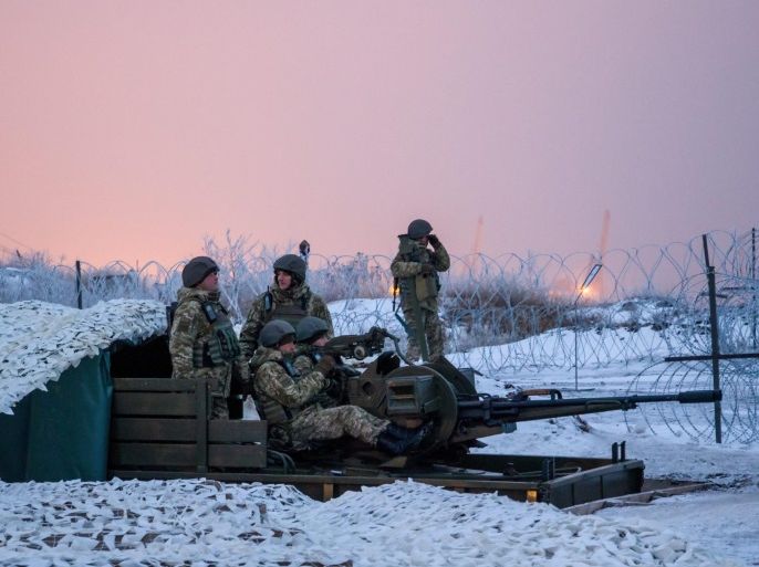 Ukrainian border guards in their positions near Mariupol, Donetsk area, Ukraine, 31 December 2016. The President together with the delegation of the US Senators visited the frontline positions of the Ukrainian Naval Forces and border guards, which holds the defense line in Shyrokyne and near Mariupol to congratulate the Ukrainian soldiers on the upcoming New Year.