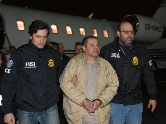 Mexico's top drug lord Joaquin "El Chapo" Guzman is escorted as he arrives at Long Island MacArthur airport in New York, U.S., January 19, 2017, after his extradition from Mexico. U.S. officials/Handout via REUTERS ATTENTION EDITORS - THIS IMAGE WAS PROVIDED BY A THIRD PARTY. EDITORIAL USE ONLY. TPX IMAGES OF THE DAY
