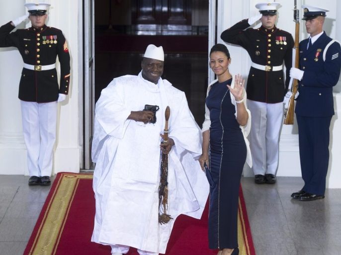 (FILE) - A file picture dated 05 August 2014 shows Gambian President Yahya Jammeh (L) and First Lady Zeinab Suma Jammeh (R) arrive at the North Portico of the White House in Washington DC, USA. Gambia on 17 January 2017 declared a state of emergency to last for 90 days, just two days before Jammeh was to step down despite rejecting the 01 December 2016's election outcome which saw Adama Barrow winning.