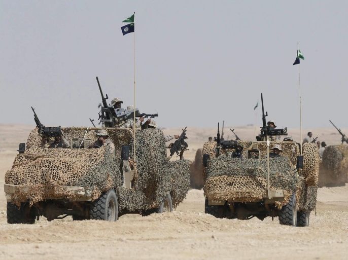 Military vehicles move in the desert as troops from Saudi Arabia and 20 allied countries perform in the final exercises of the military manoeuvre codenamed 'North Thunder' in Hafar al-Batin, Saudi Arabia, 10 March 2016. The 'North Thunder' military excerices started in mid-February in the north-eastern Saudi town of Hafr al-Batin.