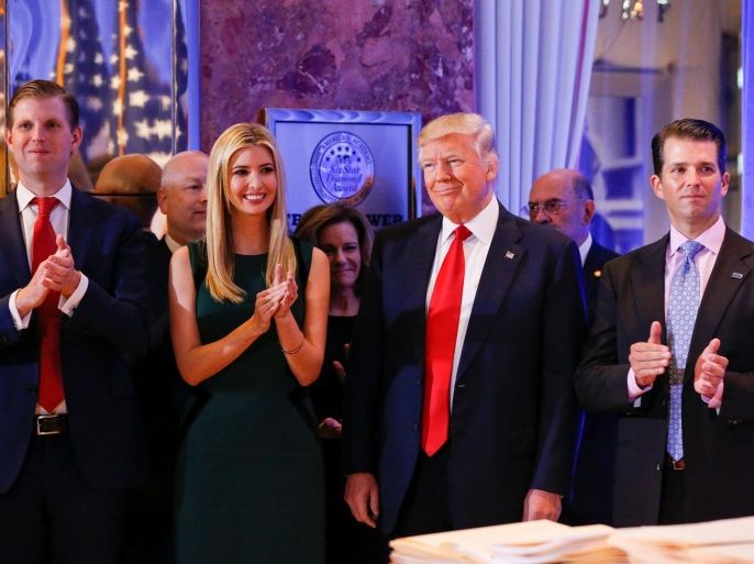 REFILE - CORRECTING ID FOR PERSON ON THE RIGHT. U.S. President-elect Donald Trump (C) smiles as he is applauded by his son Eric Trump (L) daughter Ivanka and son Donald Trump Jr. (R) ahead of a press conference in Trump Tower, Manhattan, New York, U.S., January 11, 2017. REUTERS/Shannon Stapleton
