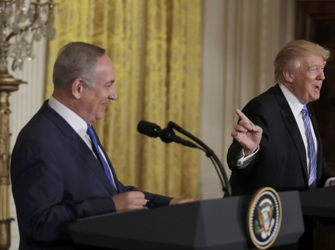 U.S. President Donald Trump (R) laughs with Israeli Prime Minister Benjamin Netanyahu at a joint news conference at the White House in Washington, U.S., February 15, 2017. REUTERS/Kevin Lamarque