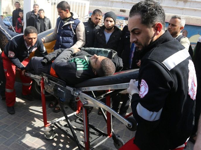 A wounded Palestinian is brought into a hospital following what police said was an Israeli air strike in Rafah in the southern Gaza Strip February 27, 2017. REUTERS/Ibraheem Abu Mustafa