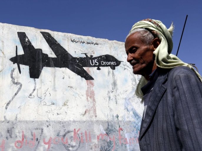 A Yemeni walks past a graffiti protesting US military operations in war-affected Yemen, in Sana'a, Yemen, 29 January 2017. According to reports, US Special Forces troops allegedly disembarked from US helicopters in the Yemeni town of Yakla and attacked several houses belonging to members of the terrorist group Al-Qaeda, killing three high-ranking Al-Qaeda members and nine civilians, six women and three children. One American serviceman has been killed and three injured