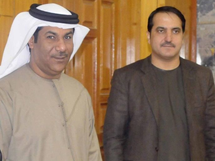 A handout photo released by the Kandahar Governor's Media office on 11 January 2017 shows Dr. Humayoon Azizi (R) the Governor of Kandahar province and Juma Al-Qabi a top diplomat of the United Arab Emirates (UAE) embassy in Kabul, during a ceremony in Kandahar, Afghanistan, 10 January 2017. According to reports twin explosions targeted a hotel in Kandahar on 10 January where a meeting between Dr. Humayon Azizi and Juma Al-Qabi was underway. EPA/KANDAHAR GOV OFFICE HANDOUT HANDOUT