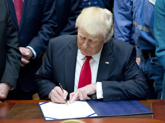 US President Donald J. Trump signs H.J. Res. 38, disapproving the rule submitted by the US Department of the Interior known as the Stream Protection Rule in the Roosevelt Room of the White House in Washington, DC, USA, 16 February 2017. The Department of Interior's Stream Protection Rule, which was signed during the final month of the Obama administration, 'addresses the impacts of surface coal mining operations on surface water, groundwater, and the productivity of m