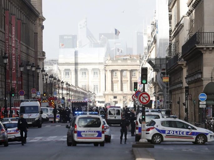 Emergency services are seen on Rue de Rivoli near the Pyramid of Le Louvre Museum, close to the Carrousel du Louvre, where a French soldier opened fire after an attempted machete attack by a man allegedly shouting 'Allahu akbar', in Paris, France, 03 February 2017.