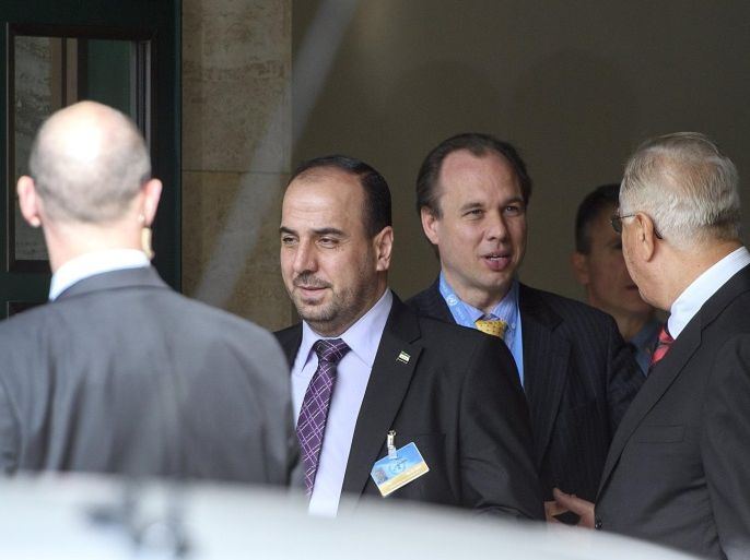 Syria's main opposition High Negotiations Committee (HNC) leader Nasr al-Hariri, centr, leaves after a round of negotiation between the High Negotiations Committee (HNC) and the UN Special Envoy of the Secretary-General for Syria Staffan de Mistura (not pictured), at the European headquarters of the United Nations in Geneva, Switzerland, February 23, 2017.