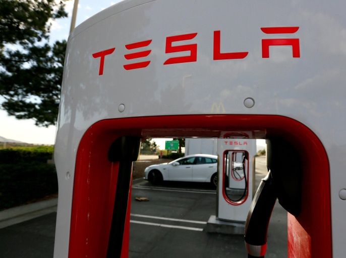 FILE PHOTO - A Tesla Model S charges at a Tesla Supercharger station in Cabazon, California, U.S. May 18, 2016. REUTERS/Sam Mircovich/File Photo