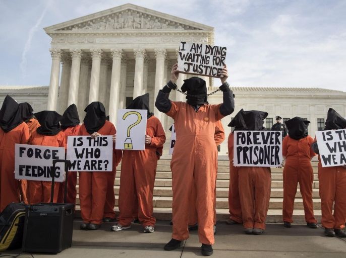 Protesters urge for the closure of Guantanamo Bay detention camp, outside the US Supreme Court in Washington, DC, USA, 11 January 2017. The closure of Guantanamo Bay detention camp was a promise made by Barack Obama during his first campaign for the presidency. The inmate population in the facility has been been greatly reduced but the effort to close it was blocked by Congress during Obama's first year as President.