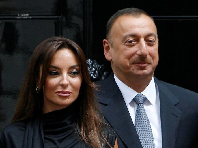 FILE PHOTO: Azerbaijan's President Ilham Aliyev (R) and his wife Mehriban pose for photographers after a meeting at 10 Downing Street in London, Britain July 13, 2009. REUTERS/Luke MacGregor/File Photo