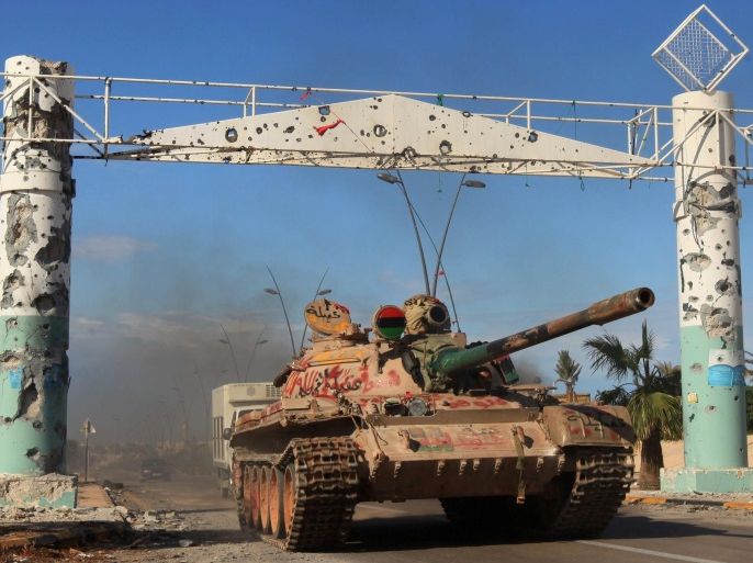 A tank is seen in the city of Sirte, Libya October 16, 2011. Libyan government fighters battled to subdue pockets of resistance by pro-Gaddafi fighters, whose refuse to abandon the ousted leader's hometown of Sirte. REUTERS/Esam Al-Fetori SEARCH "SIRTE TIMELINE" FOR THIS STORY