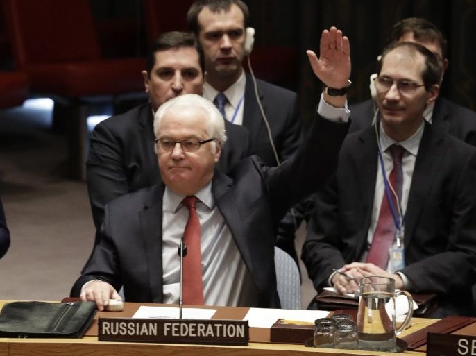 Russian ambassador to UN, Vitaly Churkin (L) is seen voting during a vote on a ceasefire in Syria at UN headquarters in New York, New York, USA, 31 December 2016. The UN endorsed the ceasefire agreement in Syria submitted by Russia and brokered with Turkey.