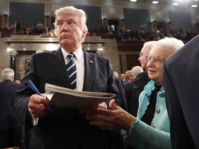 U.S. President Donald Trump signs an autograph after delivering his first address to a joint session of Congress from the floor of the House of Representatives iin Washington, U.S., February 28, 2017. REUTERS/Jim Lo Scalzo/Pool