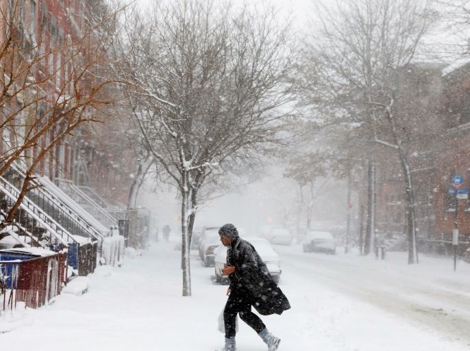 A pedestrian struggles through a heavy snow storm in the Brooklyn borough of New York, U.S. February 9, 2017. REUTERS/Lucas Jackson