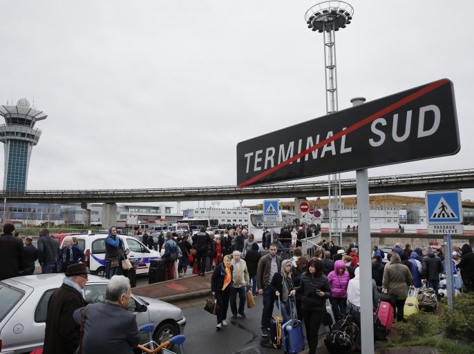 Repeating correcting date - Passengers wait at Orly airport southern terminal after a shooting incident near Paris, France March 18, 2017. REUTERS/Benoit Tessier