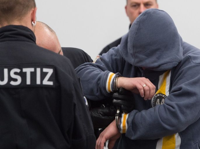 Defendant Mike S. arrives at a courtroom in Dresden, Germany, March 7, 2017, at the start of a trial against the far-right group