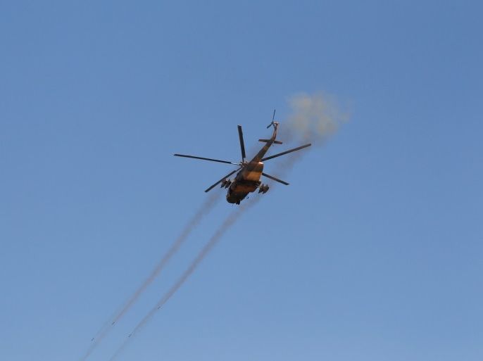 A helicopter fires towards the Taliban during a fight between Taliban and Afghan security forces in Laghman province, Afghanistan March 1, 2017. REUTERS/Parwiz