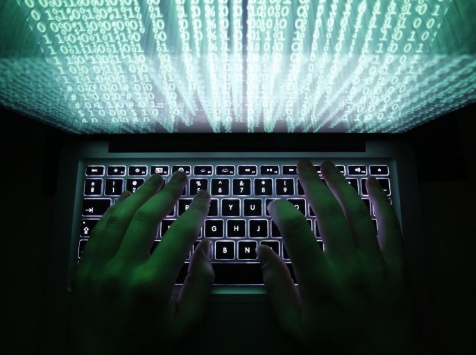 A man types on a computer keyboard in Warsaw in this February 28, 2013 illustration file picture. One of the largest ever cyber attacks is slowing global internet services after an organisation blocking
