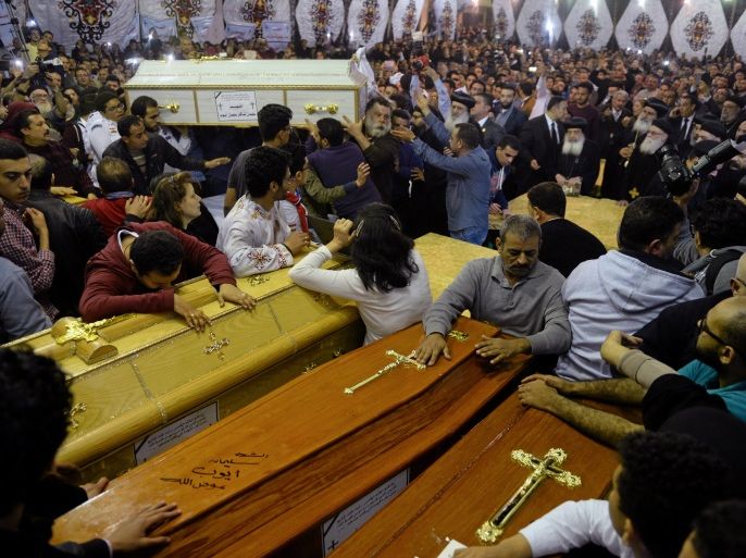 Relatives of victims react to coffins arriving to the Coptic church that was bombed on Sunday in Tanta, Egypt, April 9, 2017. REUTERS/Mohamed Abd El Ghany TPX IMAGES OF THE DAY