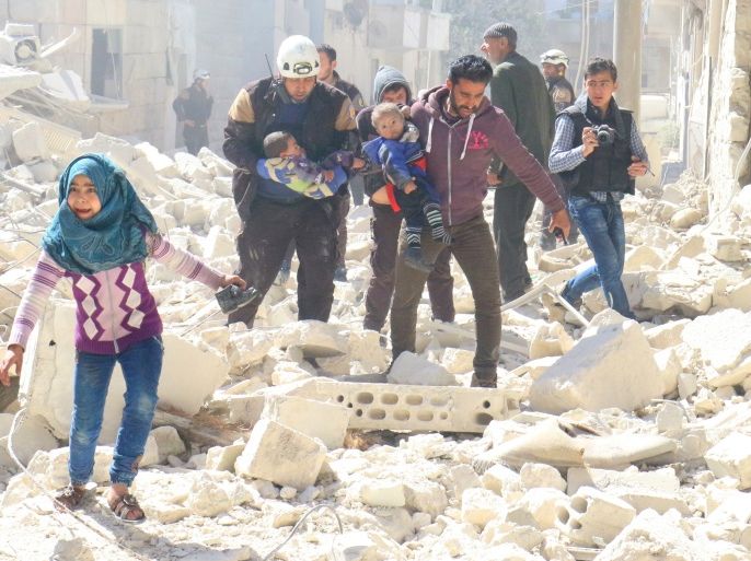 People and a civil defence personnel carry children at a damaged site after an air strike on rebel-held Idlib city, Syria March 19, 2017. REUTERS/Ammar Abdullah TPX IMAGES OF THE DAY