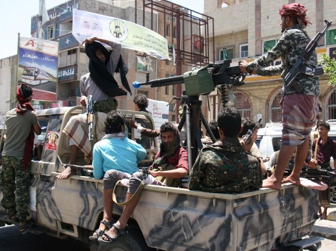 Pro-government tribal fighters patrol a street during a visit by a U.N. delegation in the war-torn southwestern city of Taiz, Yemen April 9, 2017. REUTERS/Anees Mahyoub