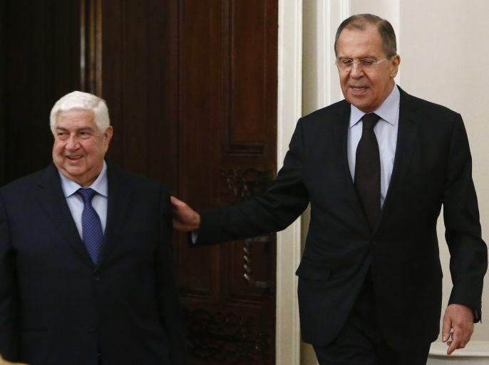 Russian Foreign Minister Sergei Lavrov (R) and his Syrian counterpart Walid al-Muallem enter a hall during a meeting in Moscow, Russia, April 13, 2017. REUTERS/Sergei Karpukhin