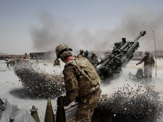 U.S. Army soldiers from the 2nd Platoon, B battery 2-8 field artillery, fire a howitzer artillery piece at Seprwan Ghar forward fire base in Panjwai district, Kandahar province southern Afghanistan, June 12, 2011. REUTERS/Baz Ratner/File Photo