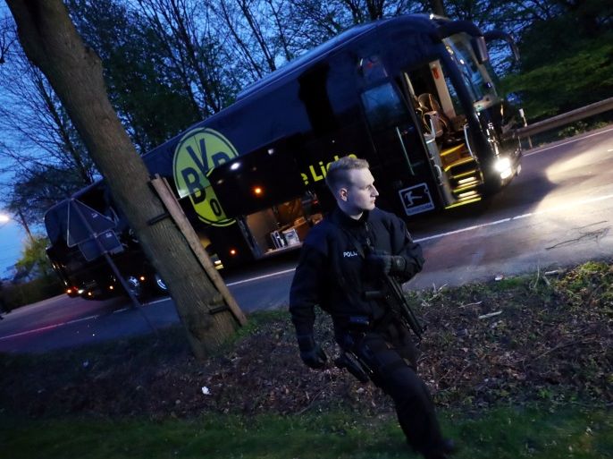 Football Soccer - Borussia Dortmund v AS Monaco - UEFA Champions League Quarter Final First Leg - Signal Iduna Park, Dortmund, Germany - 11/4/17 Police with the Borussia Dortmund team bus after an explosion near their hotel before the game Reuters / Kai Pfaffenbach Livepic TPX IMAGES OF THE DAY