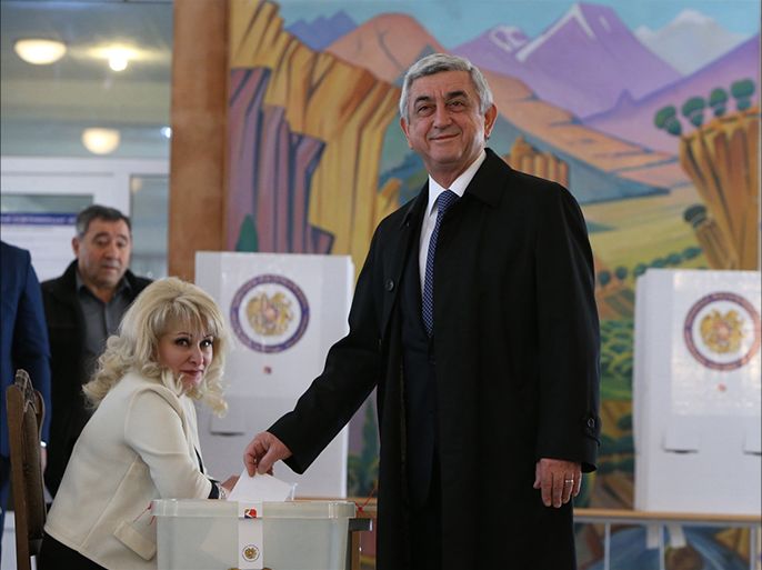 YEREVAN, ARMENIA - APRIL 02: Armenian President Serzh Sargsyan (L) casts his vote during the first Parliamentary elections after the referendum in Yerevan, Armenia on April 02, 2017.