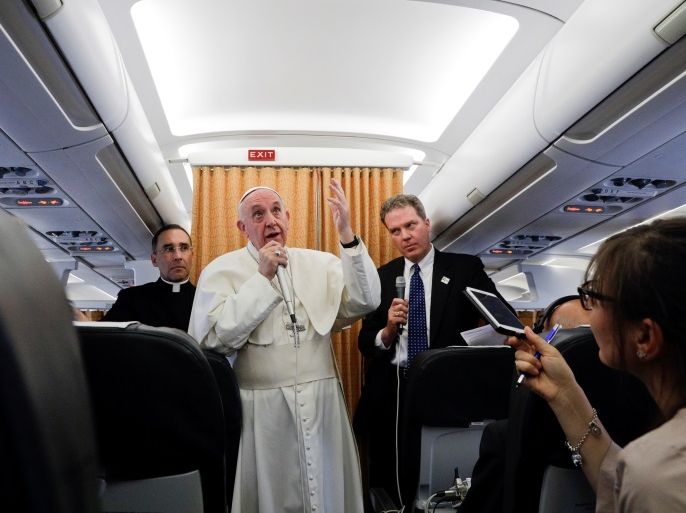 Pope Francis talks to journalists during a press conference on his return flight from Cairo to Rome April 29, 2017. REUTERS/Gregorio Borgia/pool