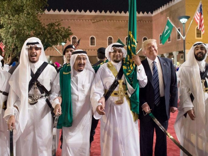 Trump (2-R) with King of Saudi Arabia Salman bin Abdulaziz Al Saud (2-L) during a welcome ceremony with traditional sword dancers at Murabba Palace, in Riyadh
