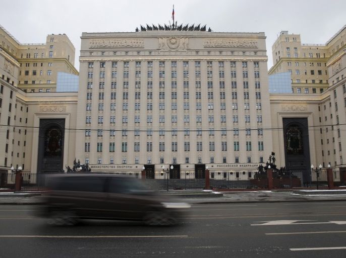 A car drives past a building of the Ministry of Defence of Russia in Moscow, Russia November 24, 2015. Turkish fighter jets shot down a Russian warplane near the Syrian border on Tuesday after repeated warnings over air space violations, but Moscow said it could prove the jet had not left Syrian air space. REUTERS/Maxim Zmeyev