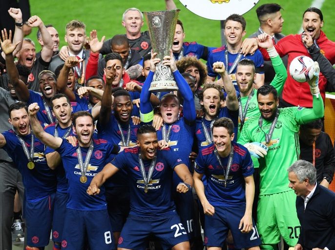 epa05987730 Wayne Rooney of Manchester United lifts the trophy after the team won the UEFA Europa League Final match between Ajax Amsterdam and Manchester United held at the Friends Arena in Stockholm, Sweden, 24 May 2017. Manchester won 2-0. EPA/VASSIL DONEV