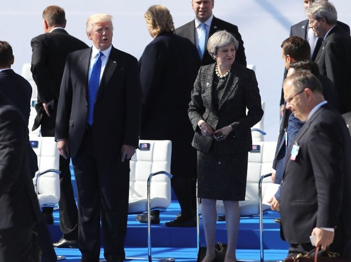 BRUSSELS, BELGIUM - MAY 25: US President, Donald Trump and British Prime Minister, Theresa May are pictured ahead of a photo opportunity of leaders as they arriving for a NATO summit meeting on May 25, 2017 in Brussels, Belgium. The North Atlantic Treaty Organisation (NATO) is made up of 28 countries. This year's summit is held at their new headquarters in Brussels. The US President Donald Trump will meet other leaders to discuss NATO taking a greater role in the fig