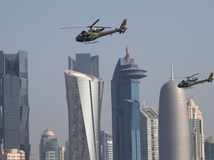 Military helicopters fly over Doha during Qatar's National Day celebrations December 18, 2015. REUTERS/Naseem Zeitoon