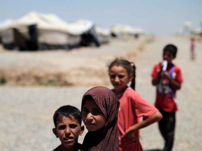 Displaced Iraqi children are seen at the Hasansham camp in al-Khazer, east of Mosul, Iraq June 13, 2017. REUTERS/Alkis Konstantinidis