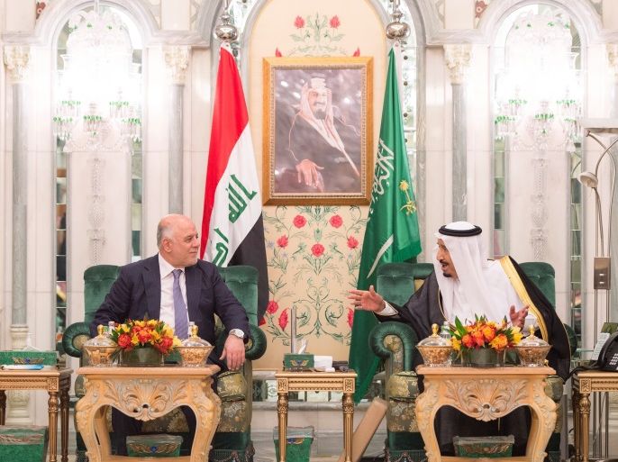 Saudi Arabia's King Salman bin Abdulaziz Al Saud (R) talks with Iraqi Prime Minister Haider al-Abadi in Jeddah, Saudi Arabia, June 19, 2017. Bandar Algaloud/Courtesy of Saudi Royal Court/Handout via REUTERS ATTENTION EDITORS - THIS PICTURE WAS PROVIDED BY A THIRD PARTY. TPX IMAGES OF THE DAY