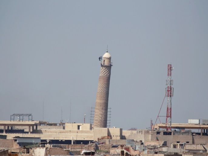 A flag of Islamic State militants is seen on top of Mosul's Al-Hadba minaret at the Grand Mosque, where Islamic State leader Abu Bakr al-Baghdadi declared his caliphate back in 2014, during clashes between Iraqi forces and Islamic State militants in Mosul, Iraq, March 24, 2017. Picture taken March 24, 2017. REUTERS/Khalid al Mousily TPX IMAGES OF THE DAY