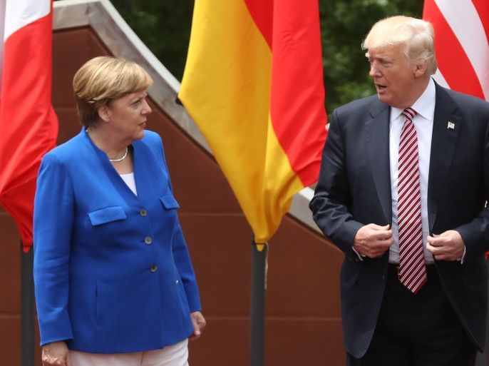 TAORMINA, ITALY - MAY 26: German Chancellor Angela Merkel and U.S. President Donald Trump arrive for the group photo at the G7 Taormina summit on the island of Sicily on May 26, 2017 in Taormina, Italy. Following the summit Chancellor Merkel expressed her disappointment that the Trump administration was unwilling to join the other six G7 member states on joint statements on climate change and refugees and said too that the E.U. could no longer count on the U.S. as the